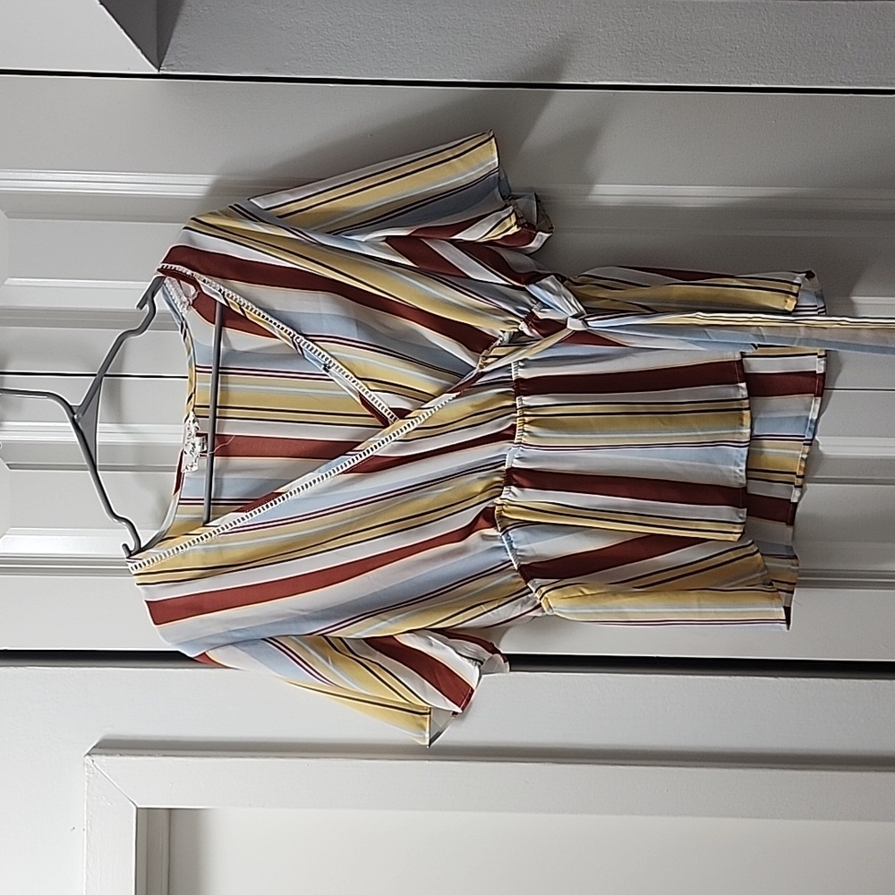 Baby doll type striped shirt, tie on the side.